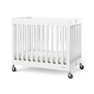 Foundations Compact Boutique Wood Folding Crib Slatted With Oversized Casters & 3' Foam Mattress White 