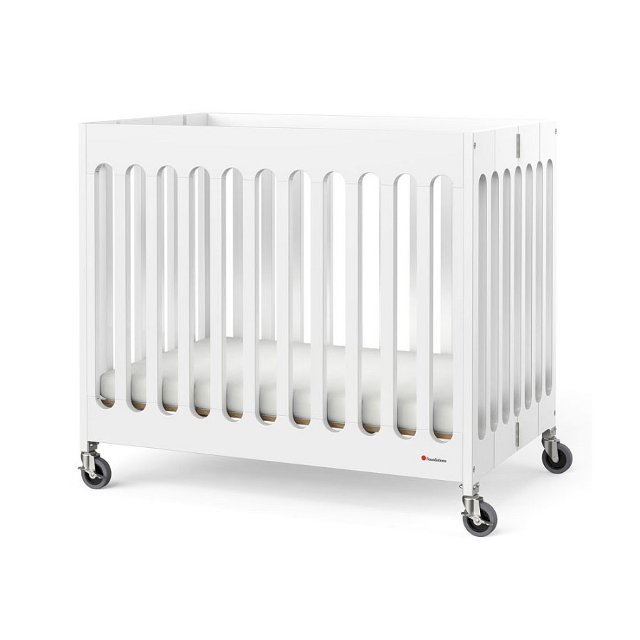 Foundations Compact Boutique Wood Folding Crib Slatted With Oversized Casters & 3' Foam Mattress White 